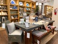 A dining table and wicker chairs at a Pottery Barn at an indoor mall in Orlando, Florida