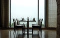 Dining table by window Royalty Free Stock Photo