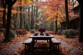 a dining table in the woods in the fall Royalty Free Stock Photo