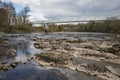 Dinkley footbridge crossing the river ribble near hurst green with rapids and rocks Royalty Free Stock Photo