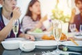 Dinner with Asian Group of best friends enjoying evening drinks while sitting at the dinning table on the kitchen together Royalty Free Stock Photo