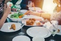 Dinner with Asian Group of best friends enjoying evening drinks while sitting at the dinning table on the kitchen together Royalty Free Stock Photo