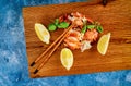 Dinner with boiled ready to eat lobster meat pieces on the table with lemon Royalty Free Stock Photo