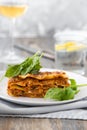 Dinner with classic lasagna bolognese with bÃÂ©chamel sauce parmesan cheese spinach Royalty Free Stock Photo