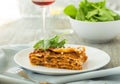 Dinner with classic lasagna bolognese with bÃÂ©chamel sauce parmesan cheese spinach Royalty Free Stock Photo