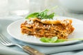 Dinner with classic lasagna bolognese with bÃÂ©chamel sauce parmesan cheese spinach