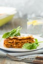 Dinner with classic lasagna bolognese with bÃÂ©chamel sauce parmesan cheese spinach Royalty Free Stock Photo