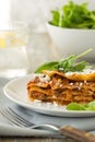 Dinner with classic lasagna bolognese with bÃÂ©chamel sauce parmesan cheese spinach Royalty Free Stock Photo