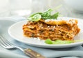 Dinner with classic lasagna bolognese with bÃÂ©chamel sauce parmesan cheese spinach Royalty Free Stock Photo