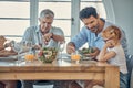 Dinner, family and child eating food at dining room table together at retirement home. Senior grandparent, happy father