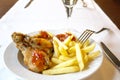 Dinner, French fries with chicken in panic Royalty Free Stock Photo