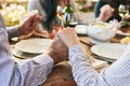 Dinner, holding hands and family prayer at table for thanksgiving celebration with faith, religion and holiday gratitude