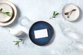 Dinner invitation mockup with modern ceramic tableware and olive branches