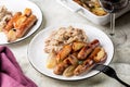 Dinner. Oven baked turkey sausages with apples and mashed potatoes Royalty Free Stock Photo