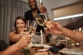 Dinner party, friends and cheers with wine glass for celebration, social gathering or new years event at home. Happy