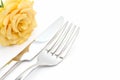 Dinner place setting. Knife and fork with yellow rose Royalty Free Stock Photo