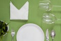 dinner place setting a white plate with silver fork and spoon on Royalty Free Stock Photo