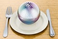 Dinner plate with disco ball mirror, 3D rendering Royalty Free Stock Photo
