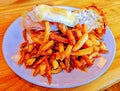 dinner plate full of french fries and turkey and egg sandwich Royalty Free Stock Photo