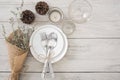 Dinner plate setting on wood table top view