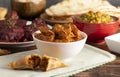 Dinner Set with Chicken Tikka Massala on a Wooden Table