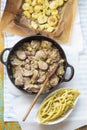 Dinner set; Pork loin chops with leeks, roasted potatoes with oregano and yellow beans with butter