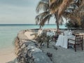 Dinner set-up on the oceanfront terrace. Summer vacation on a Maldivian paradise tropical island. Royalty Free Stock Photo