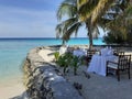 Dinner set-up on the oceanfront terrace. Summer vacation on a paradise tropical island. Maldives. Royalty Free Stock Photo