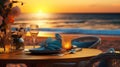 Romantic dinner setting on the beach at sunset Royalty Free Stock Photo