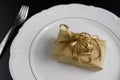 Dinner Setting with Gift. Suprize eating or gift dinner concept Royalty Free Stock Photo