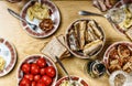 Dinner table. Festive table with different treats and dishes, a bottle of wine, top view, home furnishings Royalty Free Stock Photo