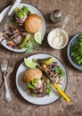 Dinner table - homemade burgers and coleslaw. Top view