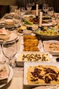 Dinner table with hummus, Carrot salad, Circassian chicken, Avocado Salad, Egg Rolls Royalty Free Stock Photo