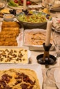 Dinner table with hummus, Carrot salad, Circassian chicken, Avocado Salad, Egg Rolls Royalty Free Stock Photo