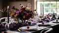 Dinner table setting in the warm glow of candlelight, tablescape featuring floral centerpiece, elegant burgundy glassware, and