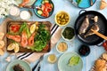 Dinner table with shrimp, fish grilled, salad, snacks and beer Royalty Free Stock Photo