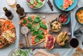 Dinner table with various food for company, top view Royalty Free Stock Photo