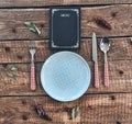 Dinner time. High angle shot of empty plate, fork, spoon, knife Royalty Free Stock Photo