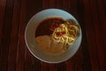 Pasta with Gravy and Meat on the wooden table Royalty Free Stock Photo