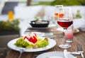 Dinner with vegetable salad and red wine Royalty Free Stock Photo