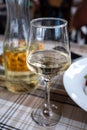 Dinner with white wine in small Greek taverna Royalty Free Stock Photo