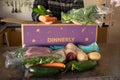 Dinnery cardbord box with meal kits open on a kitchen counter. Australian subscription delivery meal