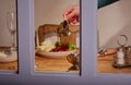 Dinning indoors view threw a window. Royalty Free Stock Photo