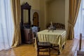 Dinning room interior with table, chairs, statue in the ancient old castle