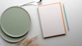 Dinning table with mock-up turquoise ceramic plates, silverware, blank notebook, pencil and golden wheat decorated on table Royalty Free Stock Photo