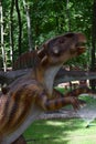 Dinosaur statue in the forest park in nature for background. Wuerlosaurus - Early Jurassic 155-150 million years ago