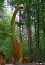 Dinosaur and baby, long necked (Brachiosaurus) in a forest