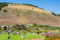 Dinosaur Caves Park, playground and walking trail, grassy lawn, green hills, and Ocean view. Shell Beach, California Royalty Free Stock Photo