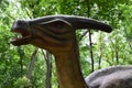 Dinosaur, parasaurolophus close on a background of greenery Royalty Free Stock Photo
