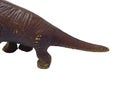 Dinosaur tail on a white background. Dinosaur toy Royalty Free Stock Photo
